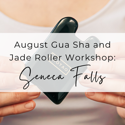 Person holding an obsidian gua sha stone with the text overlay: August Gua Sha and Jade Roller Workshop in Seneca Falls
