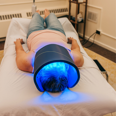 Patient getting Celluma LED light therapy and cosmetic acupuncture for acne and acne scarring at Seneca Falls Acupuncture, near Skaneateles, NY.
