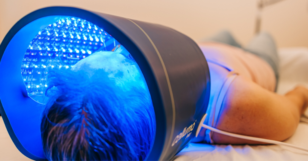 Patient resting with Celluma LED Light on the blue light acne setting at Seneca Falls Acupuncture near Skaneateles, NY